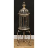 Interior Design - a floor standing lacquered brass twelve panel candle lantern, tripod scroll