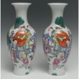 A pair of Chinese porcelain baluster vases, painted in polychrome enamels with traditional figures