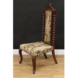 A late Victorian Jacobean Revival rosewood hall chair, arched rectangular back, spirally turned