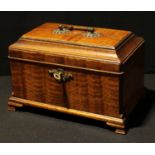 An early 19th century mahogany tea caddy, swing handle, locking with a key, 27cm wide
