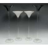 A pair of contemporary Sandra Rich glass vases, with black trumpet shaped bowls, on tall clear