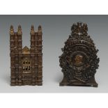 An early 20th century cast iron novelty money box, in relief with royal coat of arms and portraits