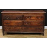 A George III oak Lancashire chest, hinged top with moulded edge above two short blind, two short and