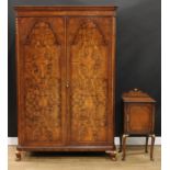 A Queen Anne inspired walnut and parcel-gilt two piece bedroom suite, comprising wardrobe, 190.5cm