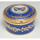 A Lynton circular gilt-metal mounted bonbonnière, painted by Stefan Nowacki, monogrammed, the hinged