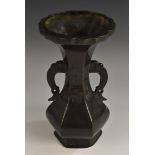 A Chinese dark patinated hexagonal baluster vase, in the Archaic taste, shaped rim, lotus scroll
