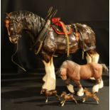 A Beswick model of a shire horse, matt brown glaze, 21cm high, printed mark in black; a set of three