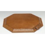 Robert Thompson, Mouseman of Kilburn - an octagonal bread board, lightly adzed, carved mouse