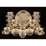 A Royal Albert Forget Me Knot pattern tea set for six, milk and sugar; a Paragon Minuet pattern