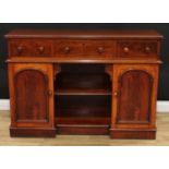 A Victorian mahogany sideboard, moulded rectangular top above three frieze drawers, the base with