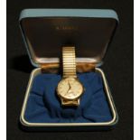 A gentleman's 9ct gold Accurist watch, champagne dial, baton indicators, subsidiary seconds dial,