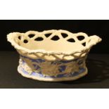 A 19th century Parian Ware basket, moulded with fruiting vine, open work trellis border, 26cm