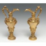 A pair of 19th century Renaissance Revival gilt bronze inverted baluster ewers, each cast with