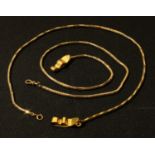 A 12ct gold fine chain, 47.5cm long; another, similar, 48.5cm long (2), 30g excluding lapel clips,
