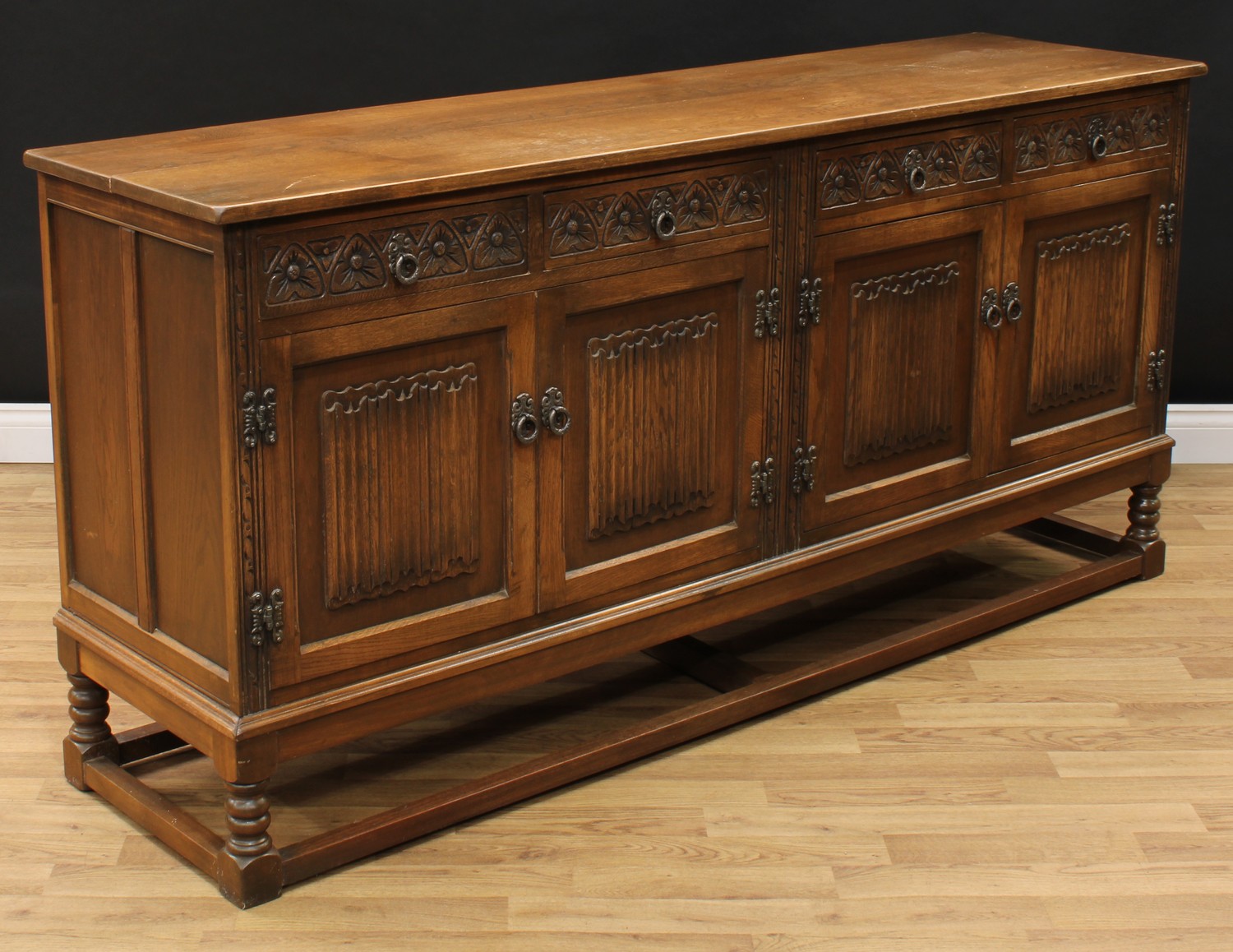 An Old Charm oak low dresser, rectangular top above four frieze drawers and two pairs of linenfold - Image 3 of 4