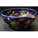 A Moorcroft pansy fruit bowl, 25cm diameter