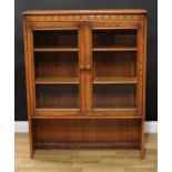 An Ercol glazed cabinet, 126.5cm high, 98cm wide, 29.5cm deep