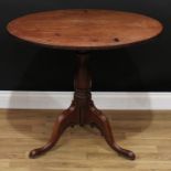 A George III mahogany tripod occasional table, circular tilting top, turned baluster column,