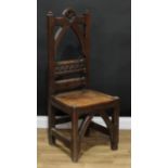 A Victorian Gothic Revival country house hall chair, arched cresting rail carved with a foliate