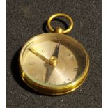 An early 20th century gilt brass pocket compass