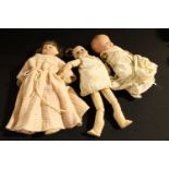 Toys and Juvenalia - a painted composition head and shoulder doll, stuffed cloth body, inset blue