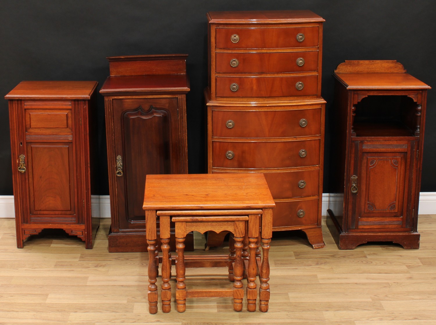 An Edwardian mahogany bedroom cupboard; others similar; a bow front chest of seven drawers, 109cm