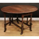 An 18th century oak gateleg table, oval top with fall leaves above a single frieze drawer, turned