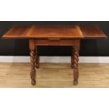 An oak draw leaf dining table, barley twist supports, 74cm high, 76cm opening to 136.5cm long,