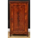 A Victorian mahogany enclosed bookcase or music room cabinet, rectangular top above a panel door