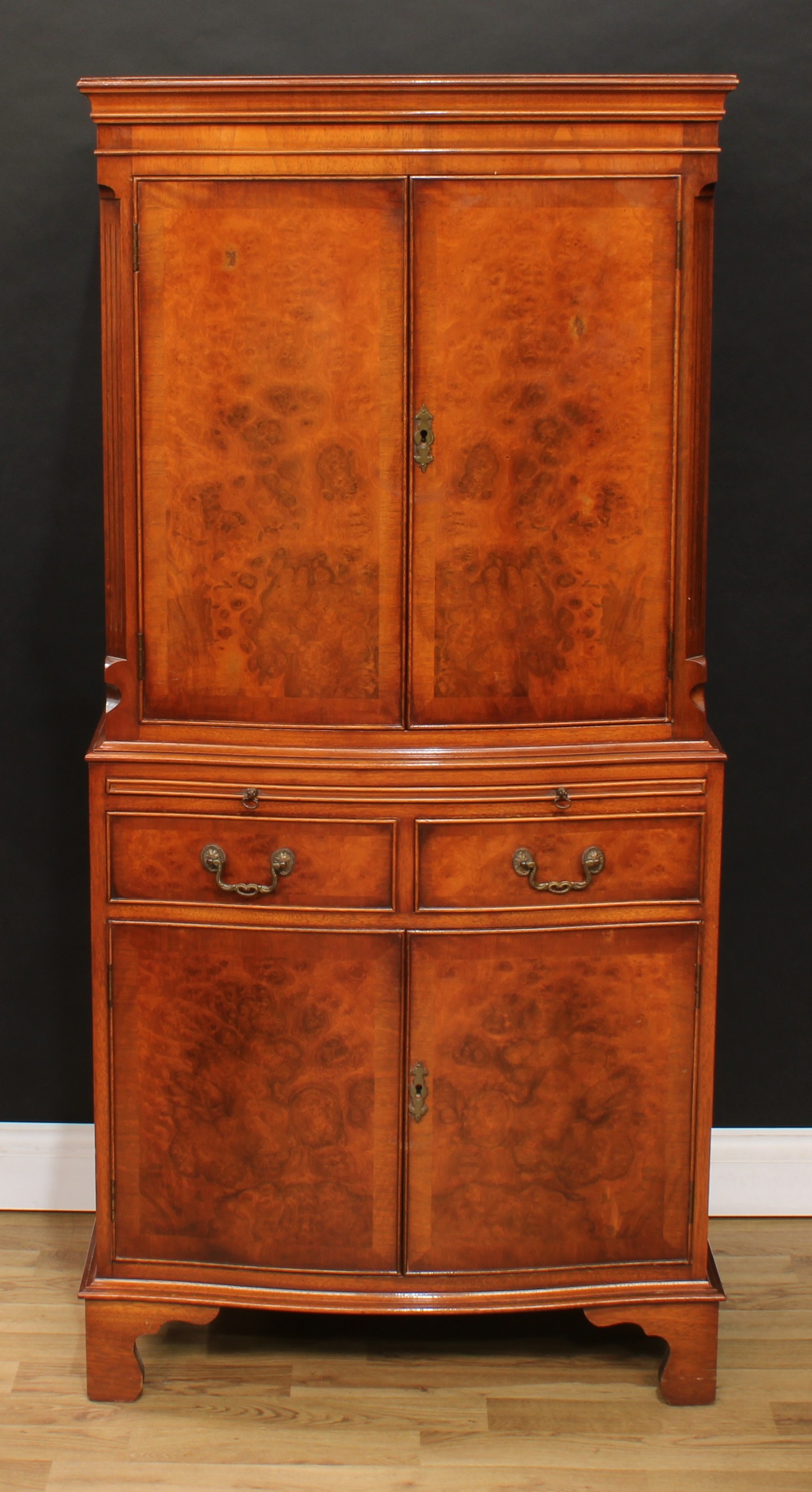 A walnut drinks cabinet, moulded cornice above a pair of cupboard doors enclosing a stepped - Image 2 of 9