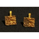 A pair of 9ct gold textured bark rectangular cuff links, marked 375, 17mm wide, 13g