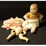 A Heubach and Koppelsdorf bisque head doll, composite body, needs re-stringing; a celluloid doll (2)
