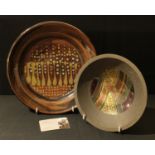 Studio Pottery - John Wheeldon, a tenmoku glazed small charger, potters mark to base, 28cm diameter;