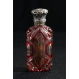 A Victorian overlaid ruby glass scent bottle, silver mounted