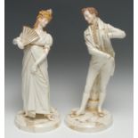 A pair of Royal Worcester figures, One Hundred Years, modelled by James Hadley, of an elegant lady