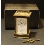 A French lacquered brass carriage clock, by L'Epee, white dial, Roman and Arabic numerals,