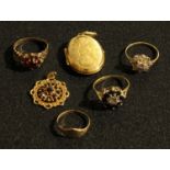 A 9ct gold flower head cluster dress ring, set with diamond chips; a 9ct gold cluster ring, set with