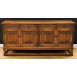 An Old Charm oak low dresser, rectangular top above four frieze drawers and two pairs of linenfold