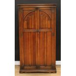 An Old Charm oak hall robe, linenfold doors, 174.5cm high, 95.5cm wide, 53cm deep