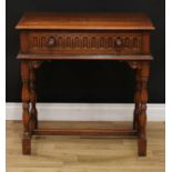A 17th century style oak side table, moulded rectangular top above a nulled frieze drawer, leafy