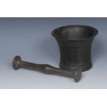 An 18th century bronze pestle and mortar, flared rim above two girdles, 10cm high, c.1700-1750