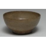 A Chinese celadon bowl, crackle glazed, 13cm diam