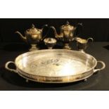A silver plated four piece tea service, a galleried two handled EPNS tray