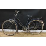 Cycling - a retro vintage Dutch Tors Super Klasse bicycle