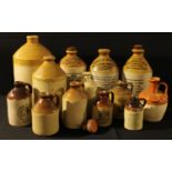 An advertising stoneware flagon, White Bros, Derby; others, Harwood & Co Carnarvon; JH Jones & Sons,
