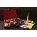 Musical Instruments - a clarinet, Buffet Crampon & Cie Paris, reeds, a reed cutter, stand,