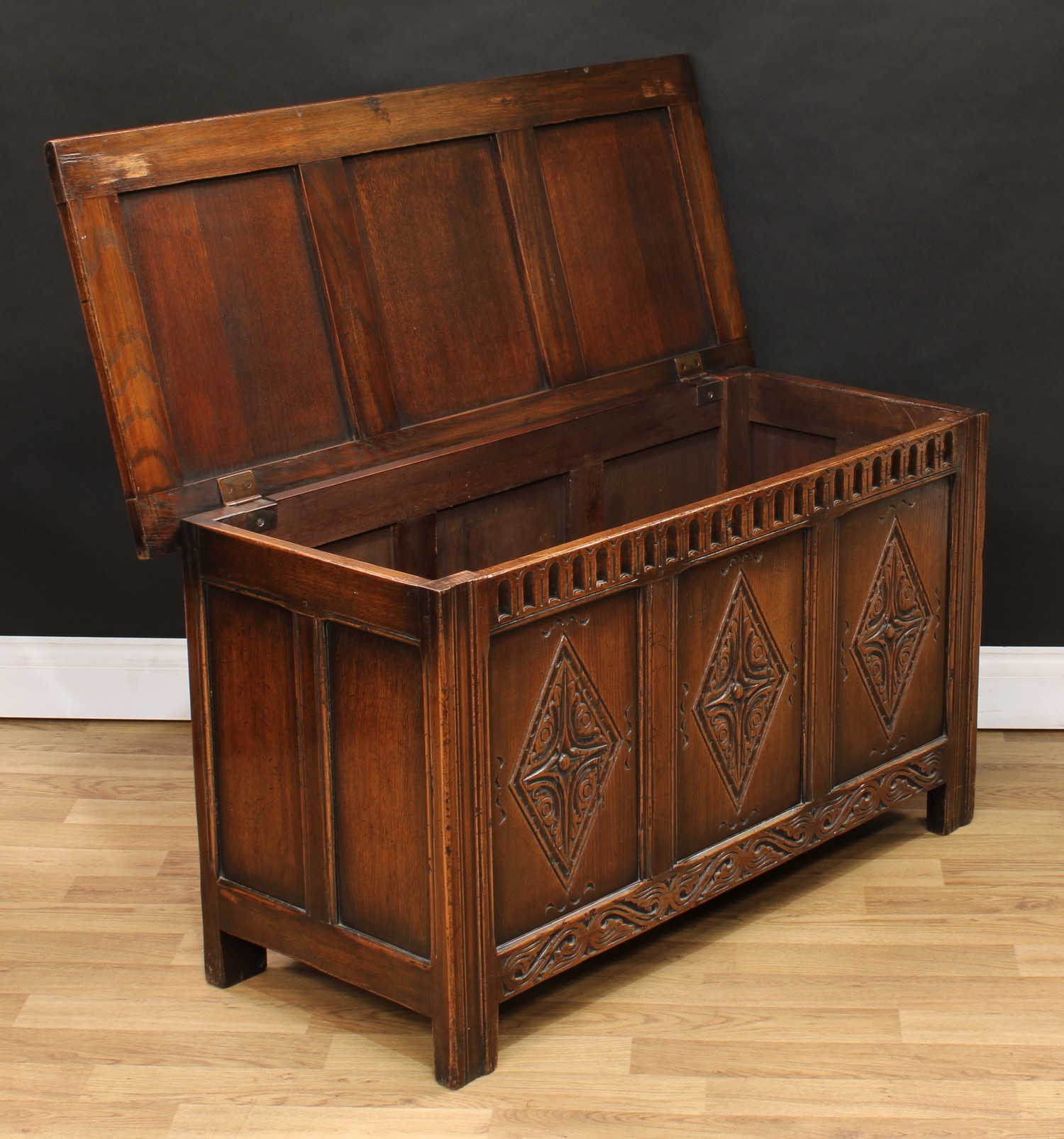 A 17th century style oak blanket chest, hinged top above a three panel front, nulled frieze, each - Image 3 of 3