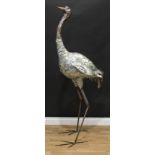 An interesting brushed steel floor standing sculpture of an ostrich type bird, 172cm high