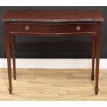 A George III style mahogany side table, serpentine top with reeded edge above a long frieze