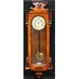 A late 19th century walnut Vienna wall clock, 105cm high, 41cm wide
